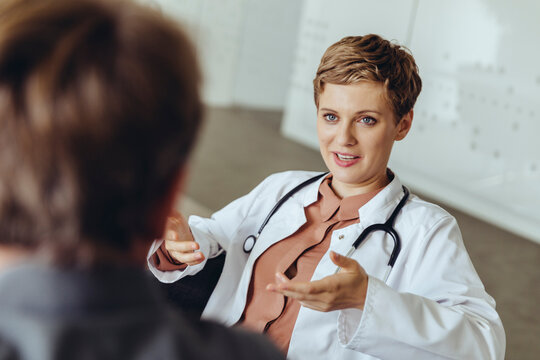 Female doctor talking to patient in practice