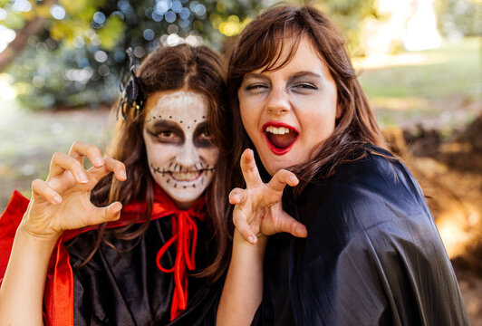 Portrait of two masquerade girls at Halloween