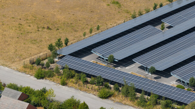Aerial view of solar panel carports in an outdoor parking lot