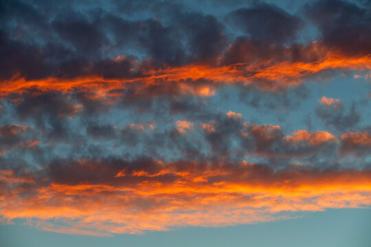 The dramatic sunset illuminates a cloud in W�rzburg