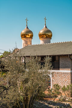 Golden domes of a Russian Orthodox monastery in Montenegro