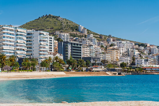 The coastal city of Saranda borders the blue sea in Albania