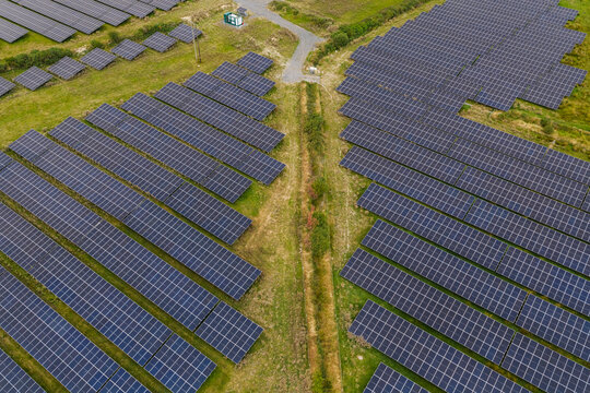 An aerial view shows a large solar park on green fields in Ireland