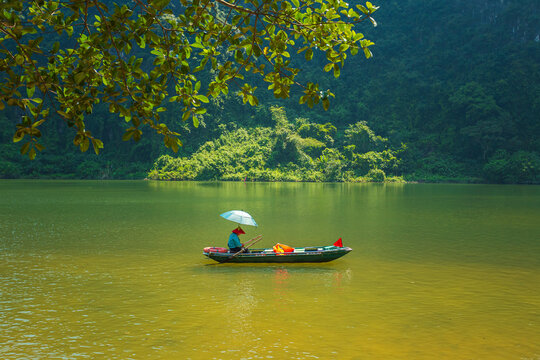 Boat ride in Trang An. Picturesque karst landscape. Ninh Binh Province, Vietnam.