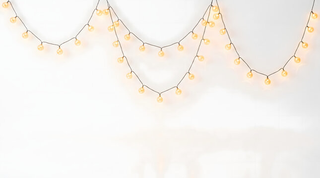 Warm glowing round globe bulb string lights suspended in triple decorative hanging swags isolated on pure white background for patio festival party celebration and wedding banner decoration