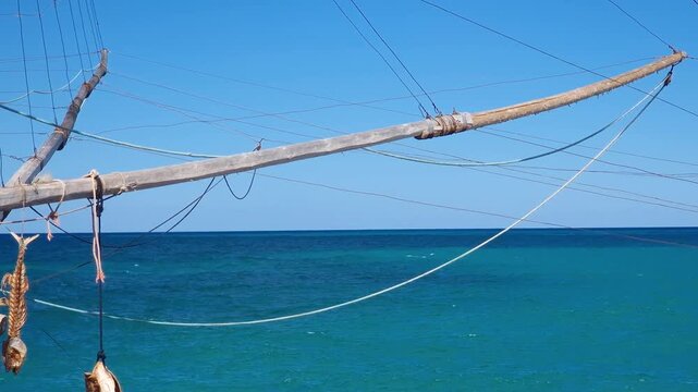 Authentic Trabucco Fishing Platform Gargano Puglia Italy. Rare Maritime Heritage, Dried Fish Hanging Wooden Poles Nets Ropes Rustic Nautical Decor B Roll 4K UHD Stock Video