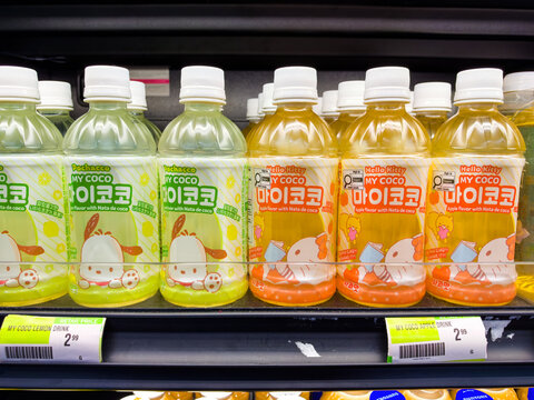 Calgary, AB, Canada. Oct 2, 2026. Hello Kitty and Pochacco flavored drink bottles displayed neatly on a grocery store shelf.