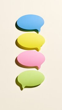 Four colorful speech bubbles stacked on a plain cream background