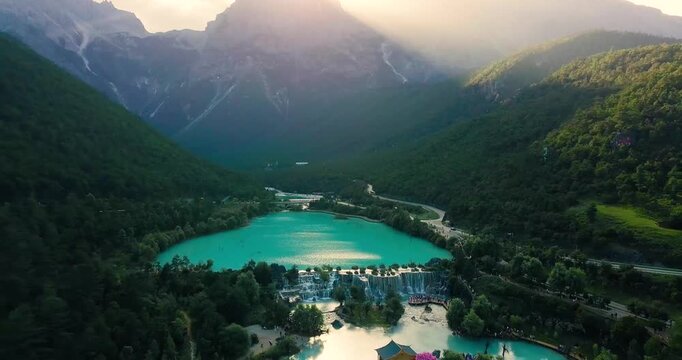 Aerial view of turquoise lake and waterfalls in Jiuzhaigou Valley, China at sunrise in Jiuzhaigou Valley, Sichuan, China