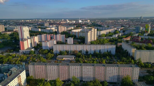 Block housing development architecture, city skyline. Smooth aerial view drone