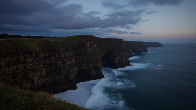 Coastal Cliff Overlooking Ocean Sea Coastline Beneath Dramatic Cloud and Sunset Headland Views