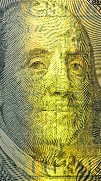Benjamin Franklin on 100 Dollar Bill in Scanning Light.  Currency security effect reveals changing detail. 