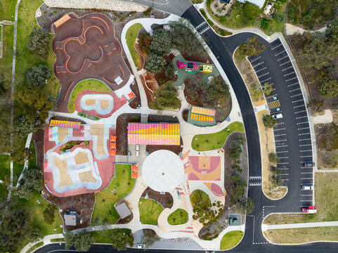 Aerial view of Duncraig Adventure Hub featuring a skate park, basketball court, and playground surrounded by trees and parking in Duncraig, Western Australia, Australia.