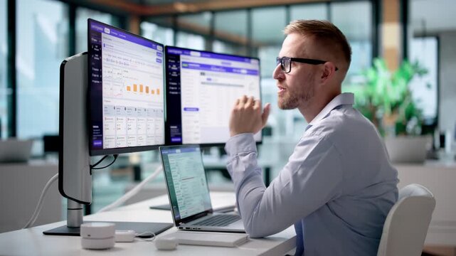 Loan Officer Carefully Reviews Borrower Credit Scores On Laptop