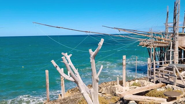 Trabucco da Mimi Gargano Puglia Italy Hidden Gem Orange Buoy Seafood Restaurant Sea View Tables Rustic Pavilion Nautical Decor Traditional Dining Rare Maritime Heritage Natural Audio B Roll 4K UHD 