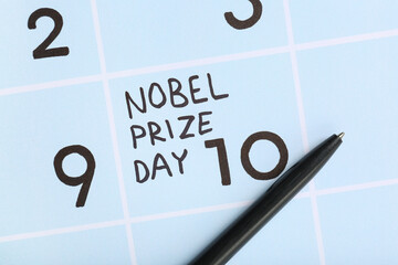 Fototapeta premium Text NOBEL PRIZE DAY with pen on calendar, closeup