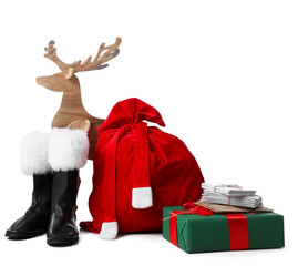 Santa Claus bag full of gifts, boots and reindeer isolated on white background © Pixel-Shot