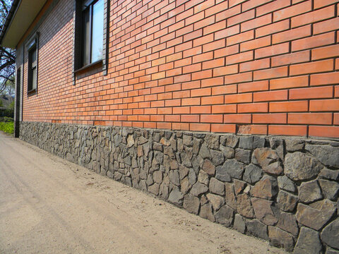 House brick wall deterioration damaged bricks facade