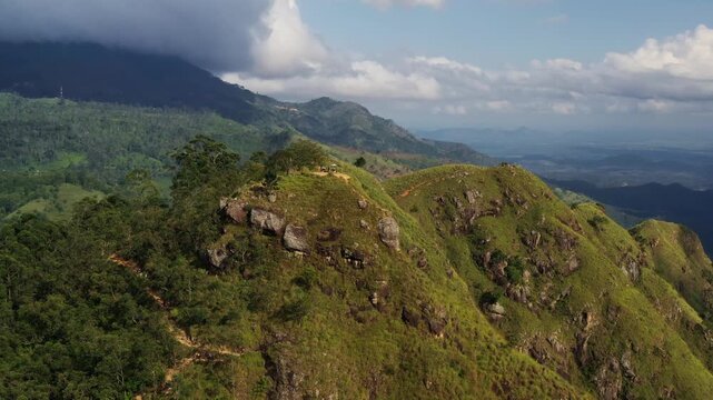 Aerial View of a Grassy Mountain Ridge in Sri Lanka Under Cloudy Skies