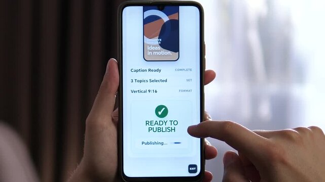 Creator publishes a vertical short-form video from a smartphone, capturing the fast-paced workflow of mobile content creation, social media publishing and the creator economy.