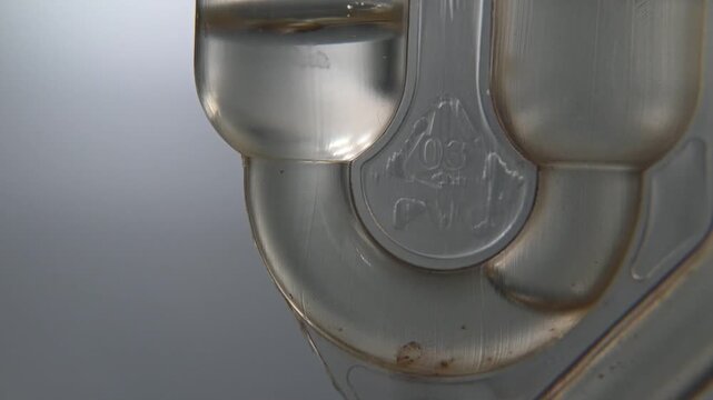 Fermentation lock used in alcohol production. Release of carbon dioxide, bubbling.
