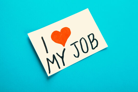 I love job text on paper note on blue background