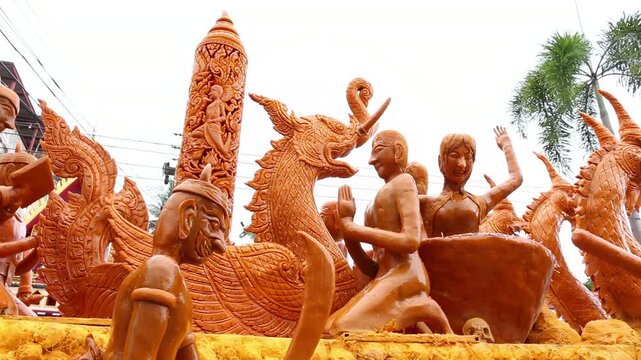 Beautifully carved wax float procession in Ubon Ratchathani Candle Festival, Thailand.
