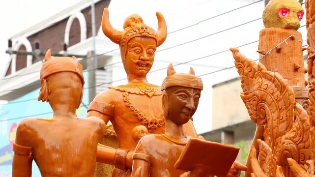 Beautifully carved wax float procession in Ubon Ratchathani Candle Festival, Thailand.