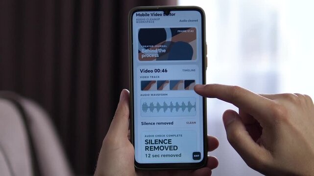 Creator edits video on a smartphone as automated audio cleanup removes silence, highlighting mobile production, faster workflows and the growing creator economy.