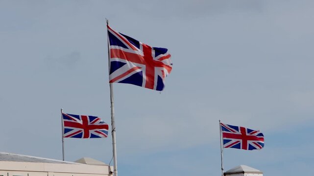 Union Jack flags fly on pier at Paignton. Devon.
