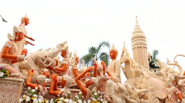 Beautifully carved wax float procession in Ubon Ratchathani Candle Festival, Thailand.