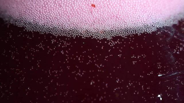 Release of gas bubbles during wine production from grapes.

