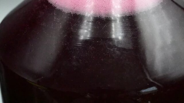 Release of gas bubbles during wine production from grapes.

