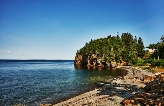 The rocky shore and wooded headland at Owls Head State Park in Knox County, Maine, New England