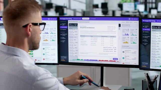 Mortgage Analyst Reviews Loan Servicing Data On Laptop