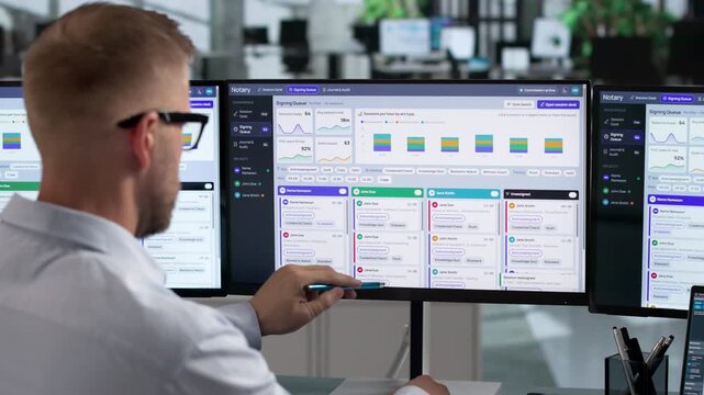 Notary Reviews Digital Documents On Laptop