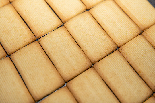 Biscuits pattern background, crisp cookie grid and bakery food texture concept