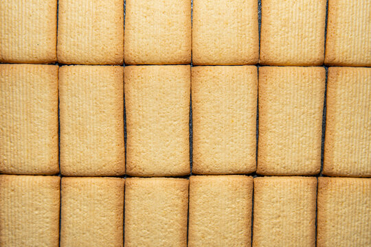 Biscuits pattern background, crisp cookie grid and bakery food texture concept