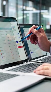 Business Analyst Reviewing Procurement Data On Laptop