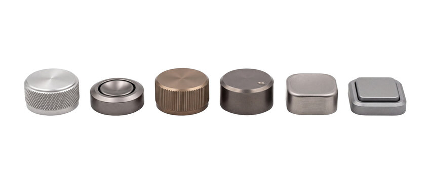Metallic control knobs volume dial set lined up on black background, modern brushed steel and bronze rotary encoder switches, tactile audio hardware interface controls for electronic UI product design