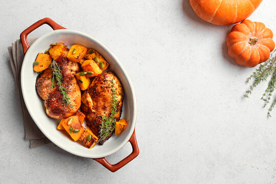 Autumn meal: roasted chicken and pumpkin with herbs