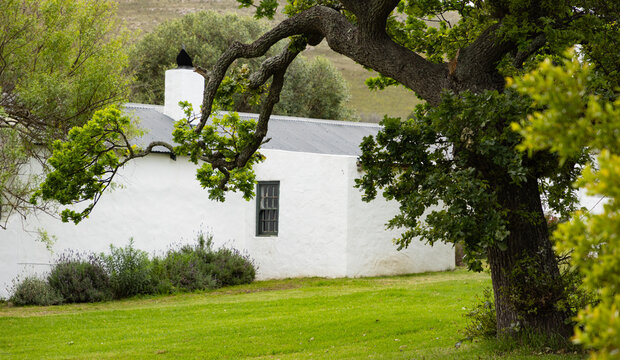 Cape Dutch buildings  and rolling hills, mountains at dawn, Stanford, South Africa