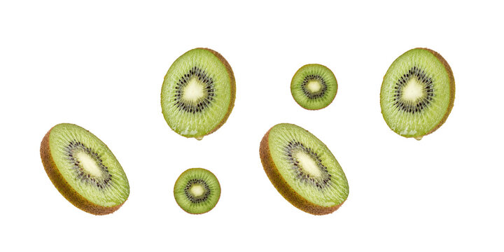 Fresh kiwi slices floating on transparent background