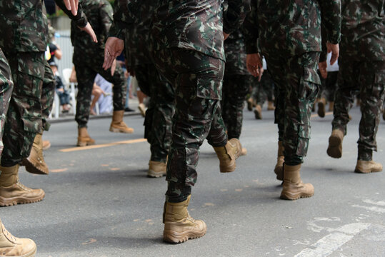 Legs and Combat Boots of Marching Soldiers