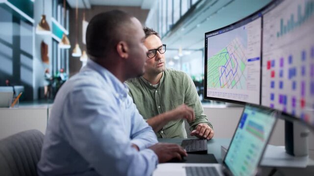 Freight Manager Reviews Shipment Board On Laptop