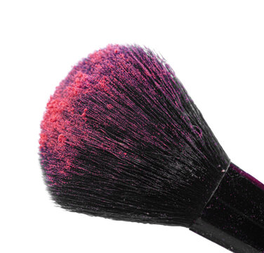Close up of a makeup brush with colorful powder