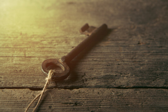 old key on wooden background