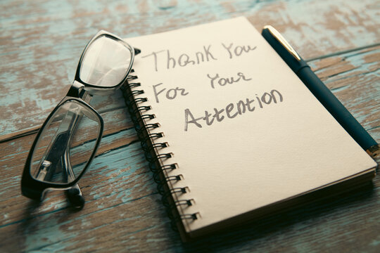 thank you message with napkin on wooden table.
