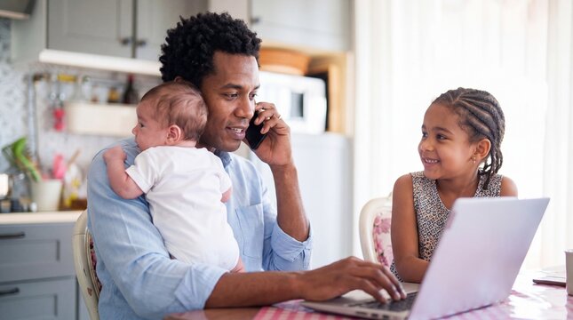 Father holding baby talking on phone while daughter uses laptop at hom