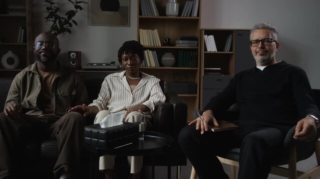 Portrait of African American couple and middle aged Caucasian therapist sitting in office during therapy session. Footage ideal for marriage counseling and mental health advertising campaigns